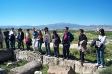 The other part of the group listening to the explanation of the excavation.