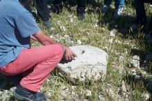 Our guide explaining a rock used for grinding flour.