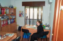 Adella, an instructor,  trying to find new ideas for conversation class.