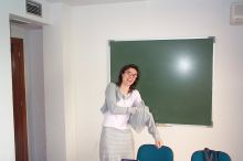 Anna, an instructor, doing what she always does, putting on more clothing as she is always cold.