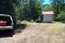 The beast parked in front of the well house.
